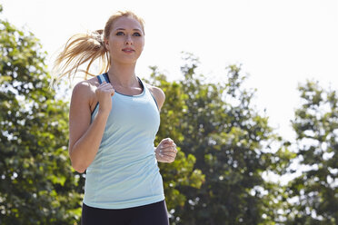 Woman running in park - ISF15391