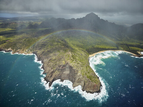 USA, Hawaii, Kauai, rainbow over Na Pali Coast, aerial view stock photo