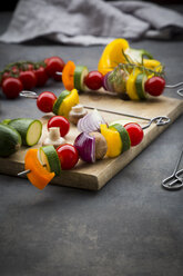 Raw vegetarian grill skewers on wooden board - LVF07184