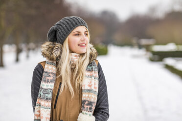 Portrait of smiling teenage girl in winter - WPEF00572