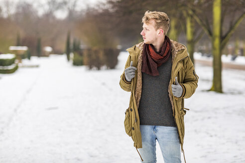 Young man in park watching something - WPEF00574