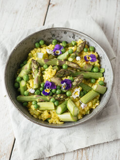 Risotto with green asparagus and peas, garnished with edible flowers - HAWF01011