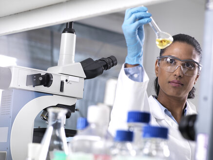 Biotechnology Research, female scientist mixing a chemical formula - ABRF00161