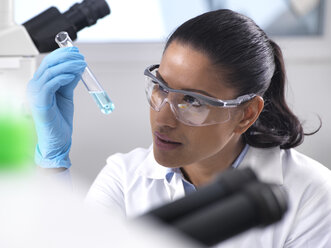 Biotechnology Research, female scientist mixing a chemical formula - ABRF00166