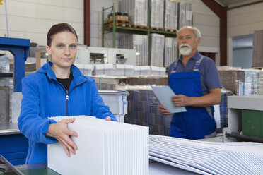 Factory workers working with cardboard - CUF38752