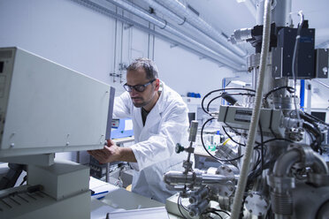 Lab assistant working on equipment - CUF38846