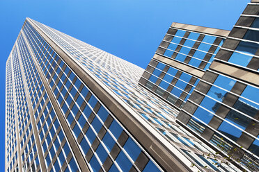 Low angled view of office buildings in financial district, Manhattan, New York, USA - ISF15740