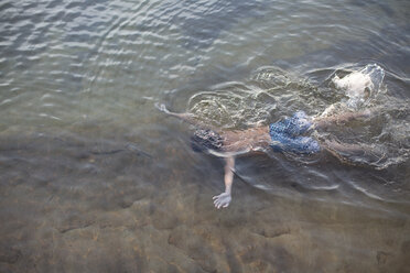 High angle view of teenage boy swimming underwater in Lake Superior, Au Train, Michigan, USA - ISF15829