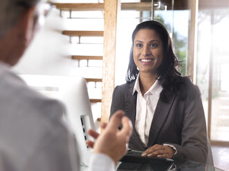 Portrait of smiling businesswoman in a meeting - ABRF00205