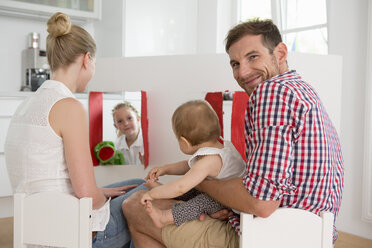 Girl doing puppet show for family - CUF39018