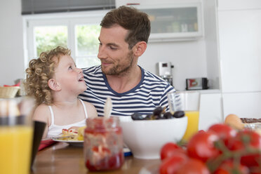 Father and daughter at kitchen table - CUF39028