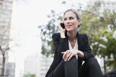 Businesswoman talking on cell phone - CUF39219