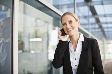 Businesswoman talking on cell phone - CUF39221