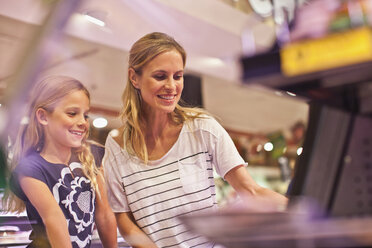 Mother and daughter in grocery store - CUF39226