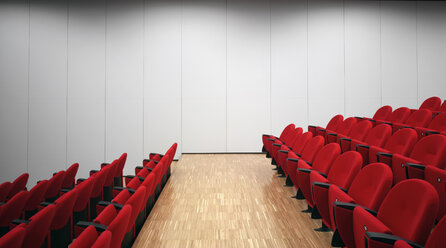 Red chairs in empty auditorium - CUF39566