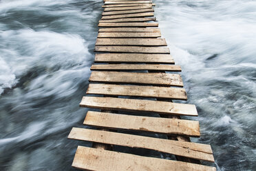 Wooden boardwalk across water - CUF39585