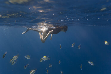 Indonesia, Bali, young woman snorkeling - KNTF01130