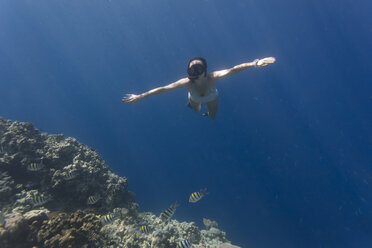 Indonesia, Bali, Young woman snorkeling - KNTF01132