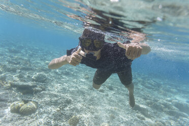 Indonesia, Bali, Young man snorkeling - KNTF01133
