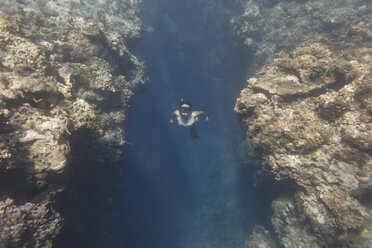 Indonesia, Bali, young woman snorkeling - KNTF01134