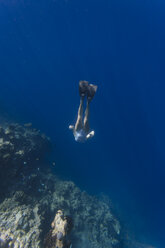 Indonesia, Bali, young woman snorkeling - KNTF01138