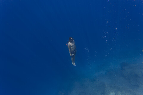 Indonesia, Bali, Young man snorkeling stock photo