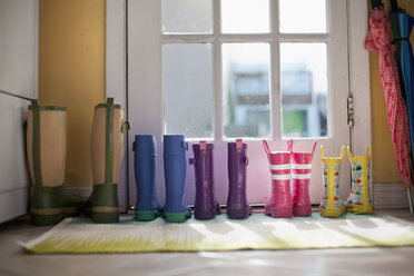 Tidy row of rubber boots at back door - ISF16918