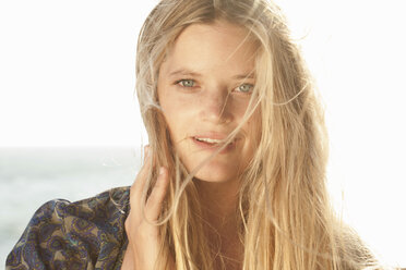 Close up portrait of young woman at the coast, Malibu, California, USA - ISF16962