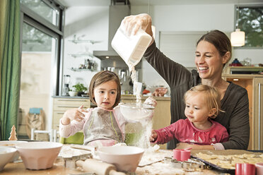 Mother and children baking in kitchen - CUF39914