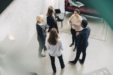 High angle view of business people discussing in meeting at office - MASF08060