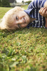 Young boy playing in garden - CUF40106