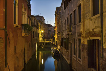 Rowboat and buildings on urban canal - CUF40176