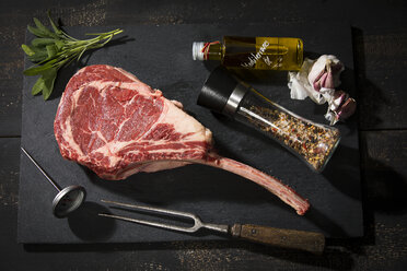 Raw tomahawk steak and ingredients - MAEF12670