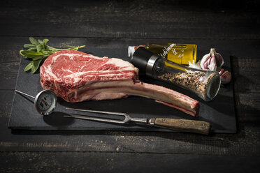 Raw tomahawk steak and ingredients - MAEF12671