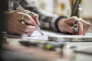 Close-up of artist drawing a sketch - ZEF15859