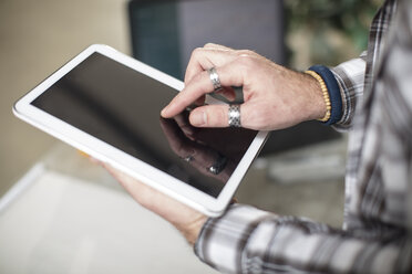 Close-up of man using tablet - ZEF15867