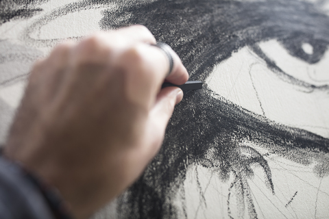 Close-up of artist drawing stock photo