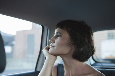 Young woman looking out of car window - CUF41262
