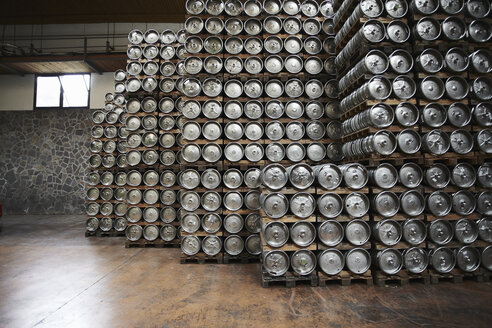 Casks of beer stacked in a brewery - CUF41772