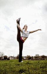 Woman practicing yoga - CUF41825