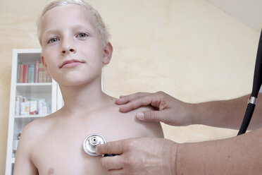 Boy being examining by doctor with stethoscope - CUF42094