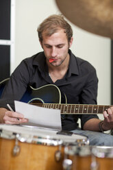 Young musician making notes - CUF42125