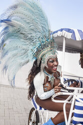 Samba dancer riding cart, Rio De Janeiro, Brazil - CUF42331