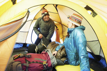 Mid adult couple in tent - CUF42399