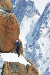 Mature man mountain climbing, Chamonix, France - CUF42414