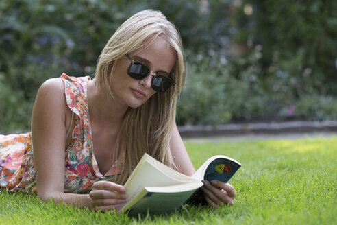 Young woman reading book - CUF42448