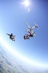 Skydivers free falling above Leutkirch, Bavaria, Germany - CUF42699