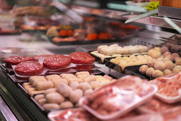 Meat products on display at a meat counter - AFVF00771