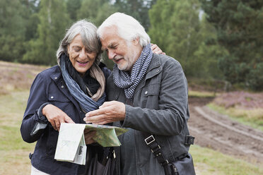 Senior couple looking at map - CUF42746