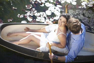 Young couple having fun in rowing boat - CUF42801